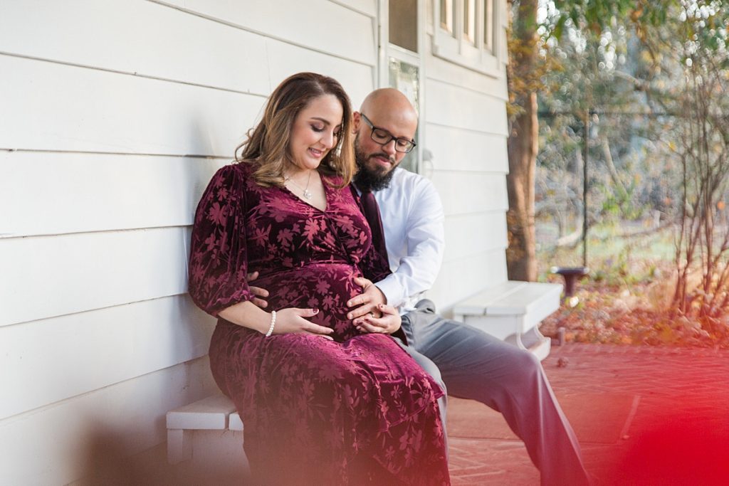 Couple sitting on bench for Maternity Session