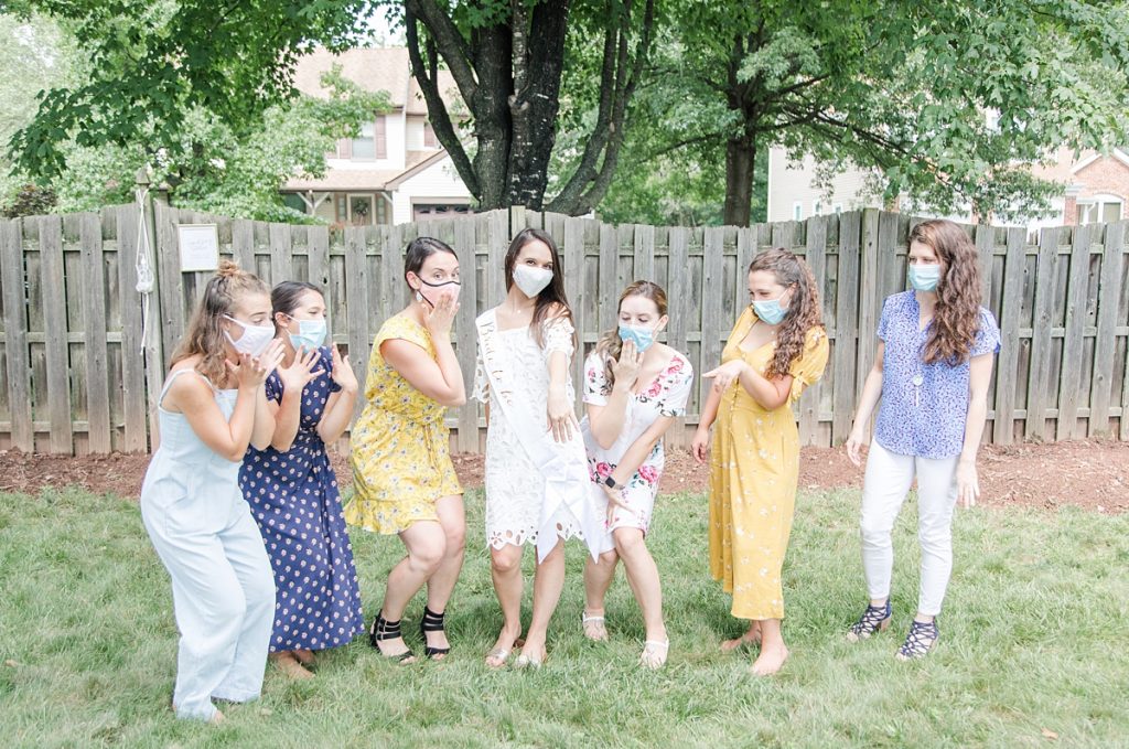 girls at bridal shower with masks