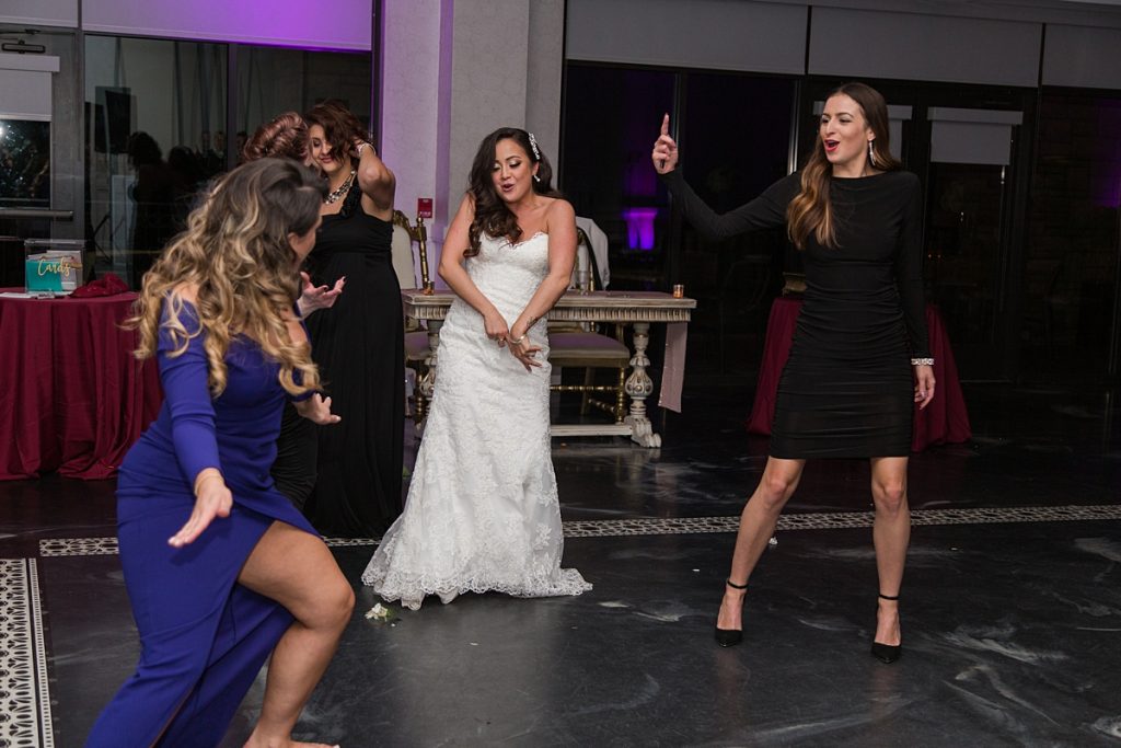 Guests dance with Bride